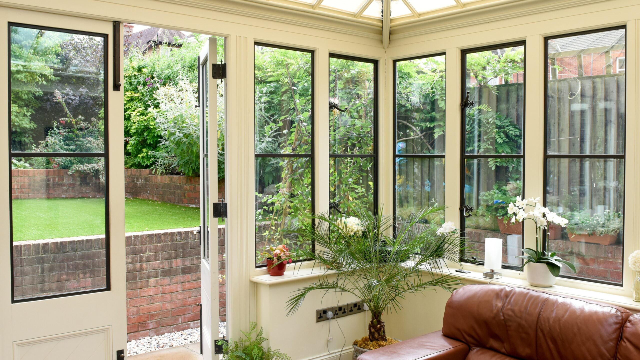 Patio enclosure with lots of windows and beautiful nature view