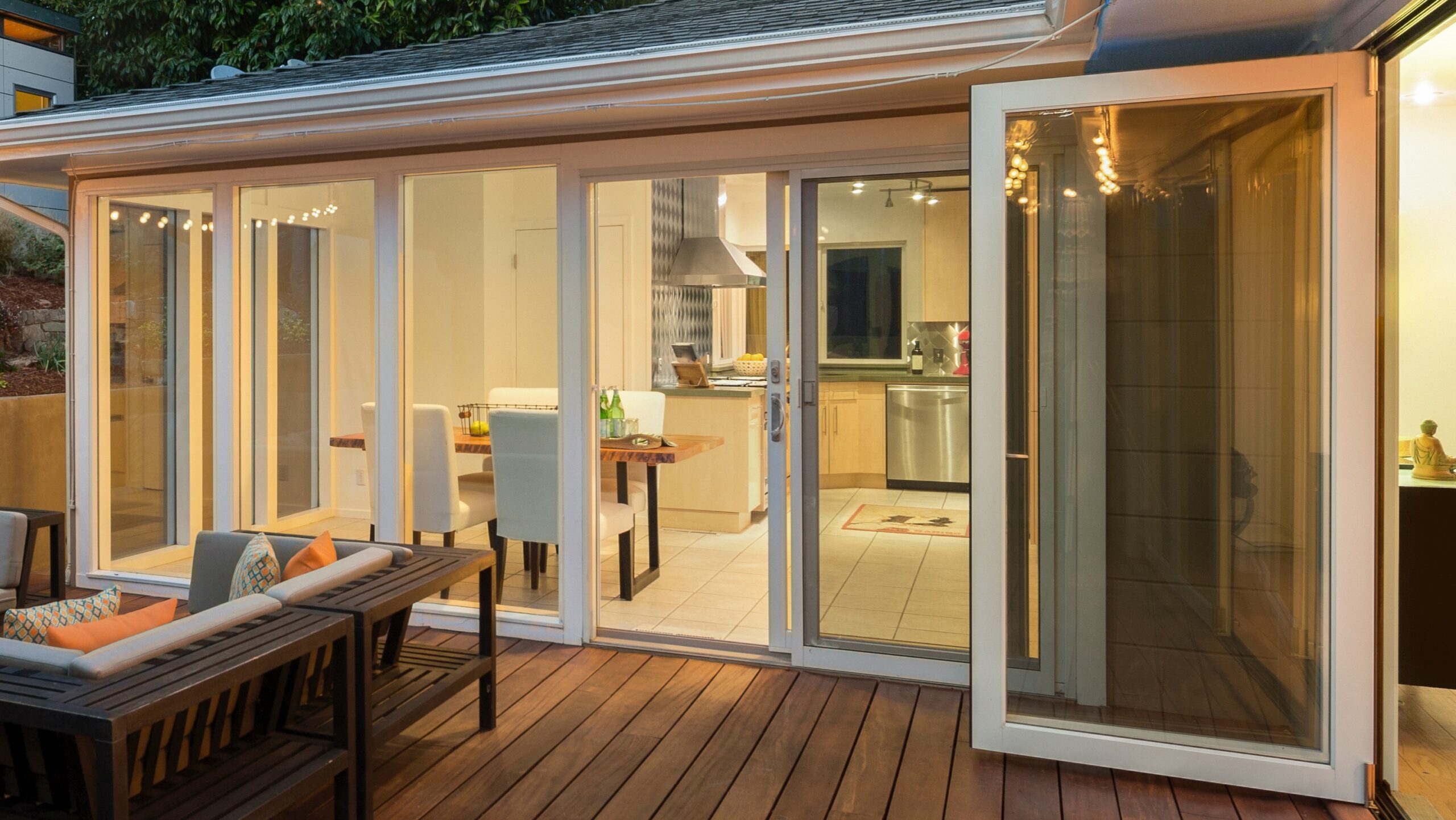 Outdoor patio view with lots of outdoor lighting at sunset