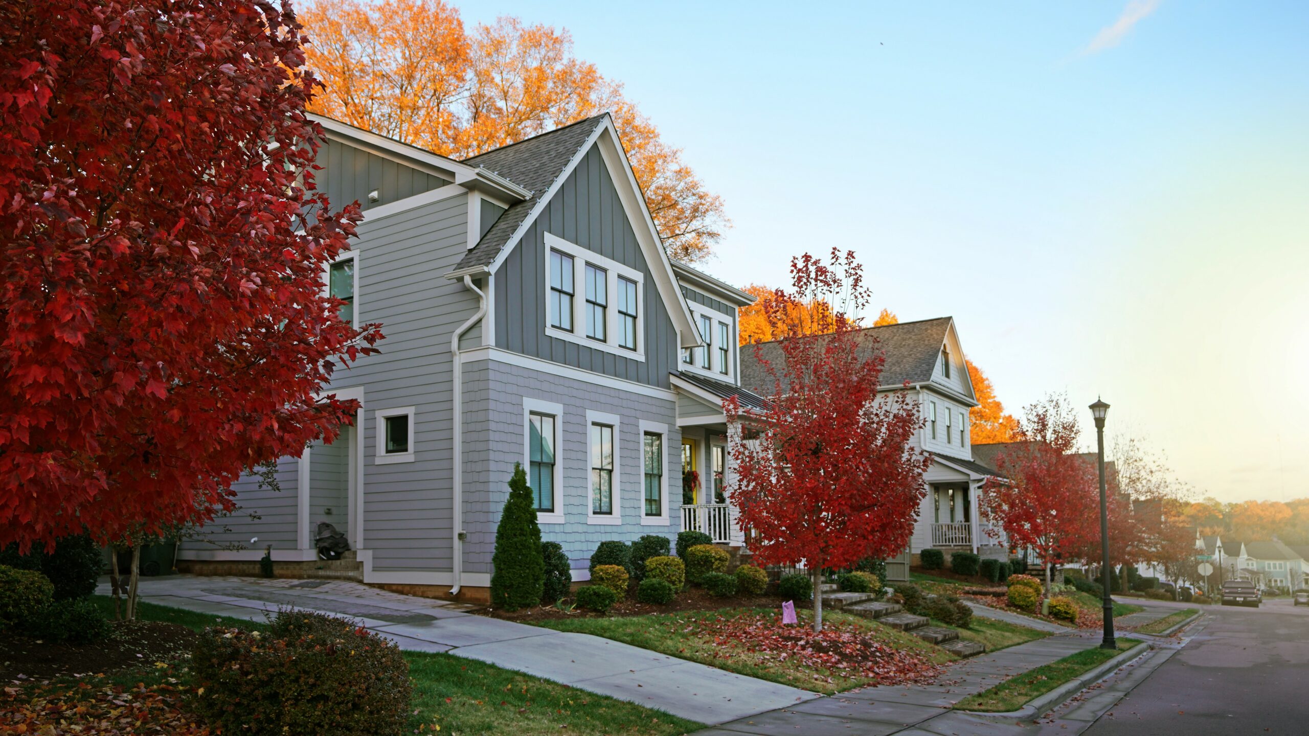 Beautiful gray house in Raleigh area with fall foliage