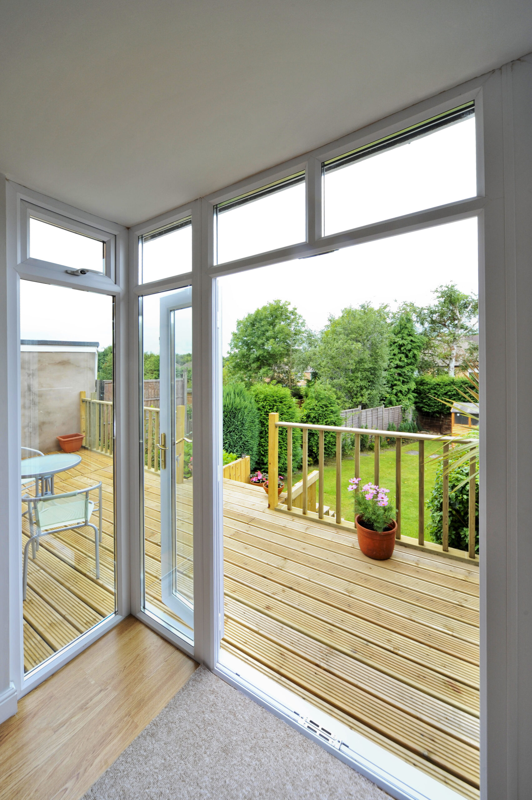 Glass patio door overlooking back deck of Garner home