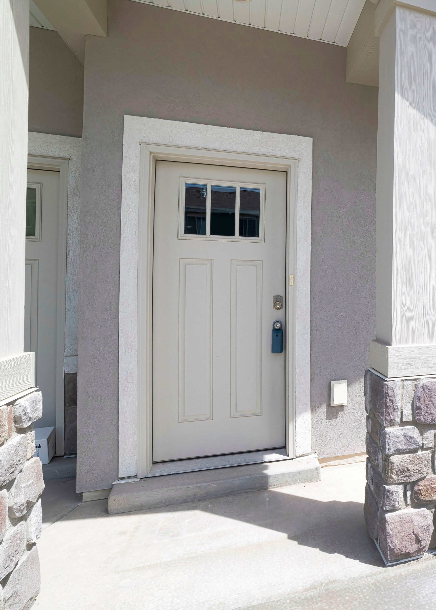 White entry door on gray home in Garner, NC