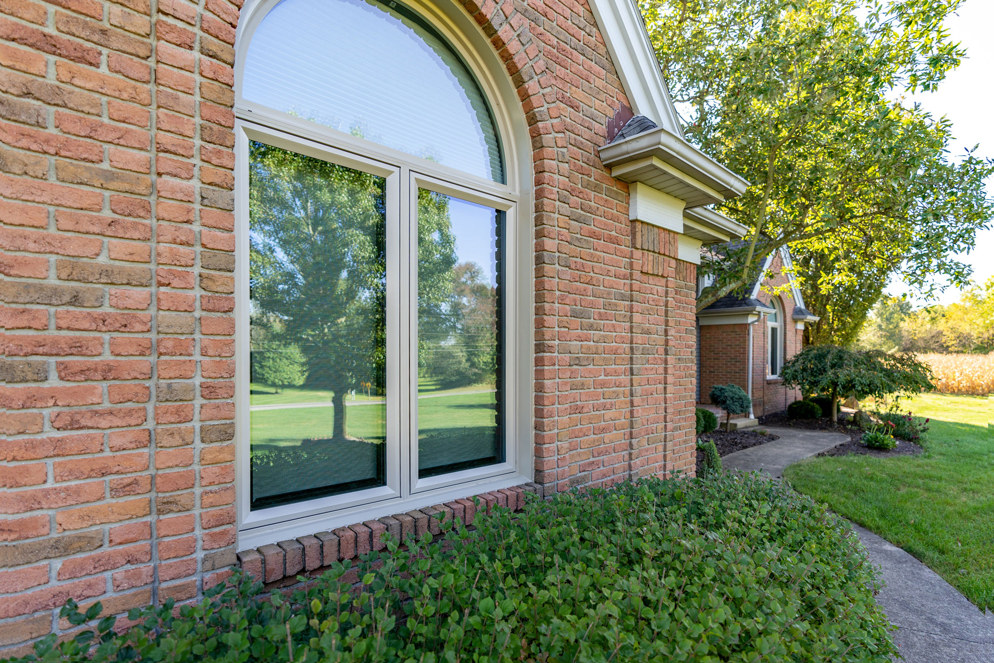 Aeris casement and shaped windows in sandstone finish