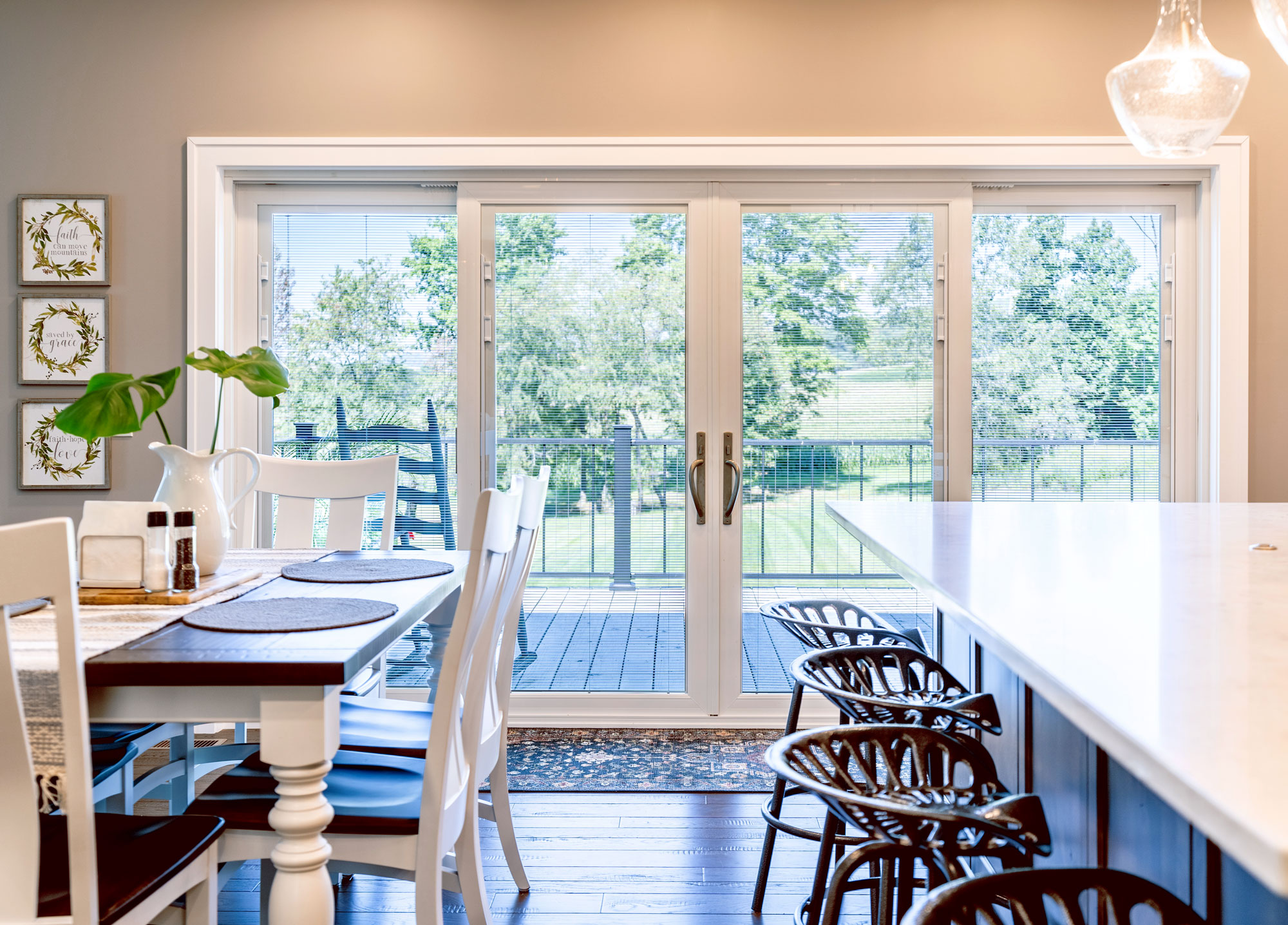Crisp sliding patio doors from inside a kitchen, right after an expert door replacement