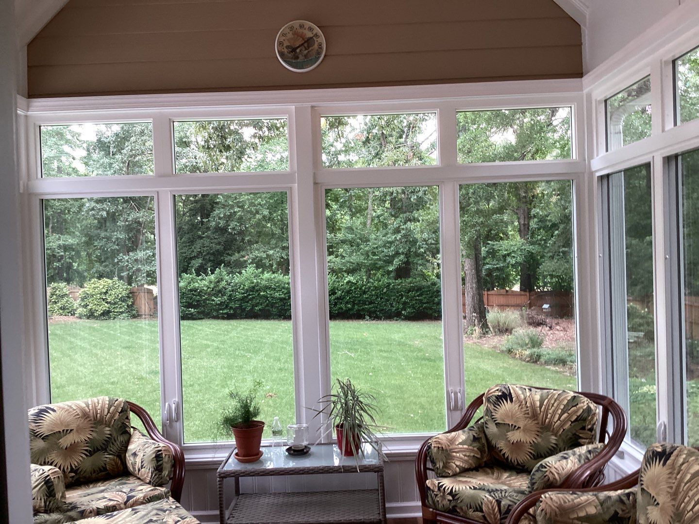 Interior view of a sunroom conversion with Endure white 2-lite casement and transom windows