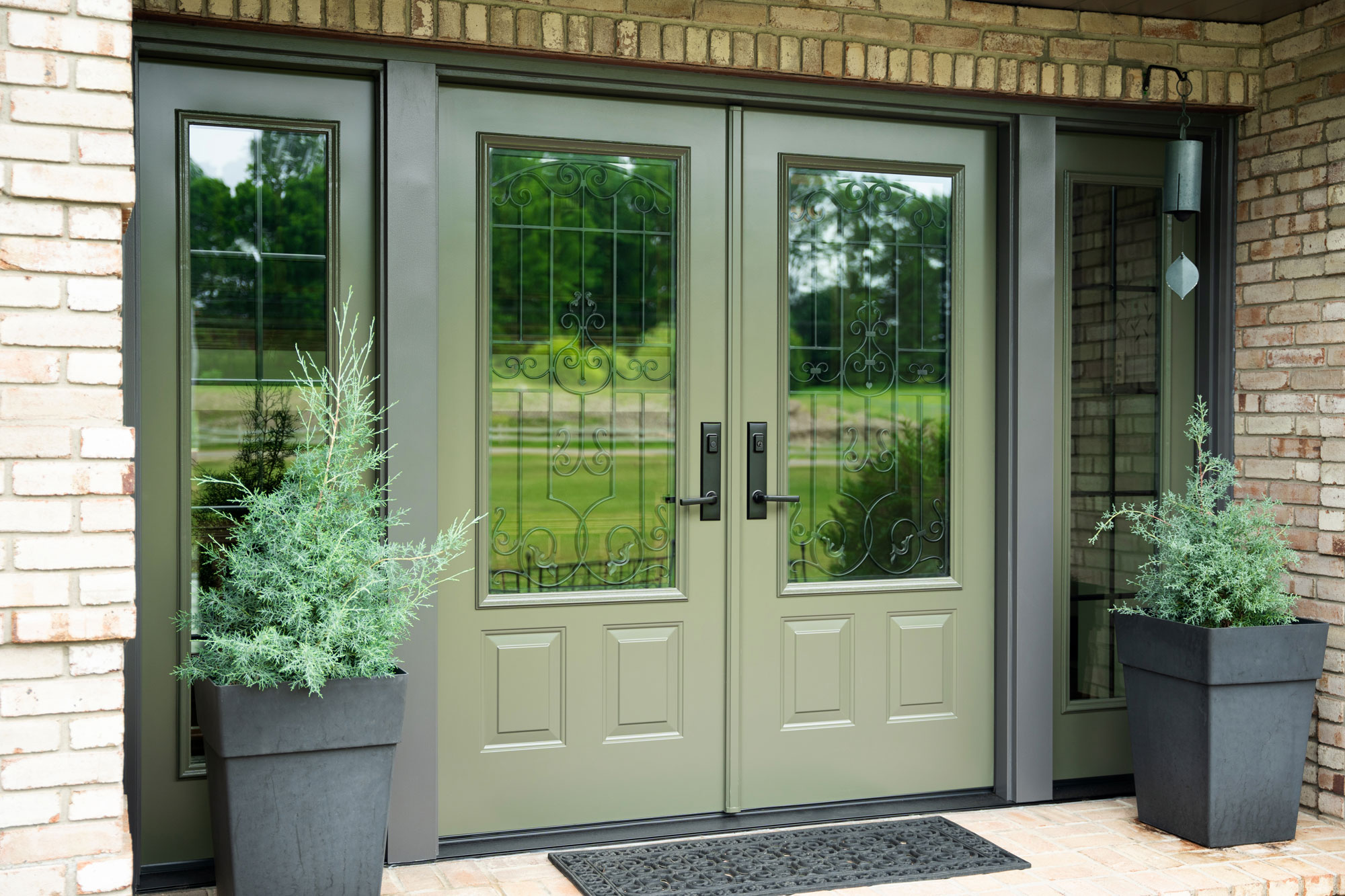 Stunning French entry doors with decorative glass and sidelights